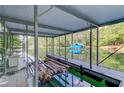 Covered boat dock with boat lift, offering direct lake access and protection from the elements at 6006 Lanier Heights Cir, Buford, GA 30518