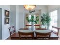 Cozy dining room features a wood table, natural light, and elegant decor, great for Gathering dinners at 118 Valleyside S Dr, Dallas, GA 30157