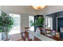 Bright dining area with hardwood floors, view of entryway, and lots of natural light at 118 Valleyside S Dr, Dallas, GA 30157