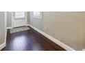 Dark hardwood floors lead the way from the front door at 2227 W Village Se Ln, Smyrna, GA 30080