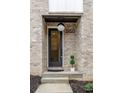 Charming front entrance with brick facade, modern door, stylish address numbers, and manicured greenery at 1968 8Th St, Chamblee, GA 30341
