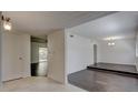 Bright living room with hardwood floors, white walls, and a view of an open dining area at 3250 Valley Bend Rd, South Fulton, GA 30349