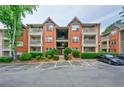 Apartment building showcasing a balcony, manicured landscaping, and reserved parking spots at 4106 Chastain Park Ne Ct, Atlanta, GA 30342