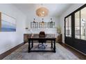 Bright office space with custom built-ins, designer lighting, and French doors leading to outdoor at 4992 Concert Ln, Marietta, GA 30066