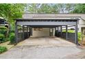 Exterior view of the carport that provides covered parking for the residence at 76 Forrest Pl, Atlanta, GA 30328
