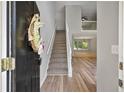 Inviting entryway featuring new flooring and stairs leading to the upper level at 3454 Benthollow Ln, Duluth, GA 30096