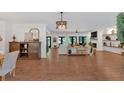 Spacious living room with hardwood floors, stylish furniture, and built-in shelving at 1421 Hendon Rd, Woodstock, GA 30188