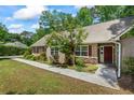 Traditional home featuring well-kept landscaping and inviting front entrance at 55 Fox Chase, Covington, GA 30016