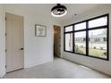 Bright, minimalist room featuring large windows and neutral tones, ideal for a home office or study at 1954 8Th St, Chamblee, GA 30341
