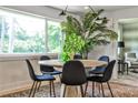 Bright dining room with a round table, stylish seating, and large windows for natural light at 2568 Laurelwood Rd, Atlanta, GA 30360