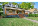 Charming home featuring a covered porch with wooden details at 378 Grant Park Pl, Atlanta, GA 30315