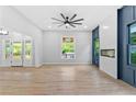 Bright, open living room with wood floors, electric fireplace, and access to the outdoor area at 378 Grant Park Pl, Atlanta, GA 30315