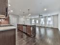 Open-concept kitchen features an island with bar seating and modern stainless steel appliances at 1020 Broadview Dr, Marietta, GA 30062