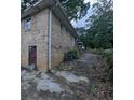Exterior view of a brick home with a back door and a driveway at 735 S Grand Nw Ave, Atlanta, GA 30318