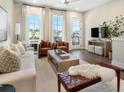 Bright living room with large windows, modern furniture, hardwood floors, and neutral decor at 1276 Longreen Terrace Nw # 115, Atlanta, GA 30318