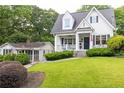 Charming two-story home with a manicured lawn and a detached guest house at 1486 Brooklyn Nw Ave, Atlanta, GA 30309