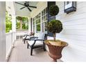 Cozy front porch with outdoor seating, potted plants, and view of landscaped surroundings at 1486 Brooklyn Nw Ave, Atlanta, GA 30309