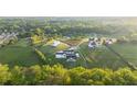 Expansive aerial view of estate home and lush surrounding landscape at 5160 Howard Rd, Cumming, GA 30040