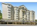 Elegant multi-story condominium building with garage parking and covered entry at 2499 Peachtree Ne Rd # 108, Atlanta, GA 30305