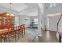 Inviting dining area featuring high ceilings, hardwood floors, and an adjacent study area at 1990 Cooper Lakes Dr, Grayson, GA 30017