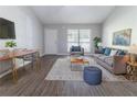 Comfortable living room with stylish furniture, wood floors, and ample space at 340 Onyx Ct, Atlanta, GA 30349