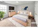 Bright bedroom featuring a plush rug and modern decor at 5480 Walnut Ln, Lithonia, GA 30038