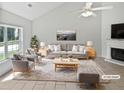 Bright living room with neutral tones, fireplace, and large windows at 5480 Walnut Ln, Lithonia, GA 30038