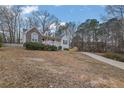 Attractive home featuring a well-kept lawn and a quaint, covered entryway at 954 Josie Ct, Lawrenceville, GA 30045