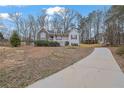 Inviting two-story home with a welcoming front yard and a long driveway at 954 Josie Ct, Lawrenceville, GA 30045