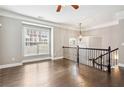 Open living space with hardwood floors, large window, and elegant railing at 2252 Limehurst Ne Dr, Atlanta, GA 30319