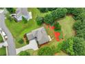 Aerial view of a landscaped backyard and beautiful neighborhood at 3120 Caney Creek Ln, Cumming, GA 30041