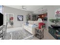 Open-concept living area with a comfortable sofa, stylish decor, and seamless flow to the kitchen at 400 W Peachtree Nw St # 3611, Atlanta, GA 30308