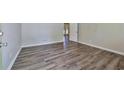 Bedroom featuring modern gray vinyl plank flooring, neutral paint and an exterior door at 5666 Goldfield Dr, Acworth, GA 30102