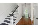 Inviting foyer with hardwood floors and staircase, bathed in natural light at 49 Willow Gln, Atlanta, GA 30342