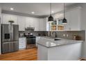 Modern kitchen features granite countertops, stainless steel appliances, and white cabinetry at 174 Crumley St, Atlanta, GA 30312