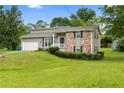 Charming two-story home with manicured lawn, attached garage, and inviting front porch at 1903 Lochlomand Se Ln, Smyrna, GA 30080