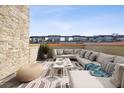 Spacious roof deck with ample seating is perfect for entertaining with views of the city skyline at 1199 Huff Nw Rd # 127, Atlanta, GA 30318