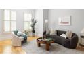 Bright living room with modern furniture, hardwood floors, and large windows for natural light at 461 Bartram Se St # A, Atlanta, GA 30316