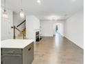 Open-concept living space with fireplace, hardwood floors, and ample natural light at 4922 Longview Walk, Decatur, GA 30035