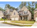 Attractive two-story home with a well-kept lawn and symmetrical facade at 891 Channel Dr, Lawrenceville, GA 30046