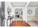 Welcoming foyer with hardwood floors and views into the living and dining areas at 891 Channel Dr, Lawrenceville, GA 30046