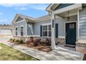Close-up of the home's entrance, showcasing the front door, sidelights, and brick foundation at 3919 Shelleydale Dr, Powder Springs, GA 30127