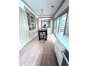 Bright dining area with built-in cabinets, wood floors, and access to outdoor deck at 574 Chicasaw Ne Dr, Marietta, GA 30060