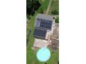 Aerial view showcases home featuring a pool, deck, and solar panels on the roof at 3112 Calumet Nw Cir, Kennesaw, GA 30152