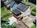 Exterior angle showcases a home with a deck, pool, solar panels and a fenced-in backyard at 3112 Calumet Nw Cir, Kennesaw, GA 30152