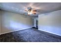 Spacious living room featuring neutral paint, new carpet, and a view into the hallway at 5904 Heatherwood Ln, Riverdale, GA 30296