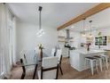 Open concept design featuring a dining table next to the updated kitchen at 3285 Country Walk Dr, Powder Springs, GA 30127