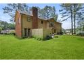 Spacious backyard with well-maintained lawn and privacy fence, perfect for outdoor activities at 3472 Honeycomb Se Dr, Conyers, GA 30094