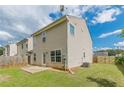 Home's backyard featuring a patio, a lawn, and a privacy fence at 150 Alton Cir, Villa Rica, GA 30180
