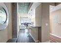 Bright living space with a bar counter, hardwood floors, and scenic city views at 250 Pharr Ne Rd # 1112, Atlanta, GA 30305